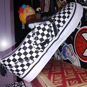 Vans toddler size 9. Checkered slip-ons